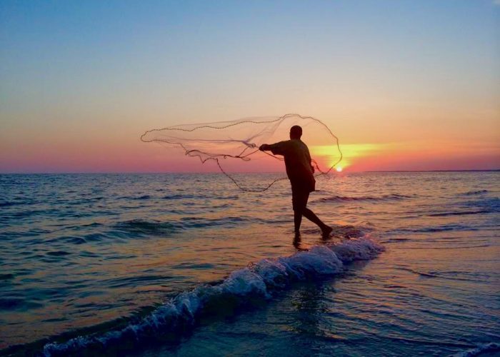 Throwing A Cast Net at Sunset