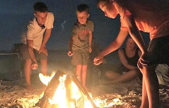 Making Smores Around A Campfire