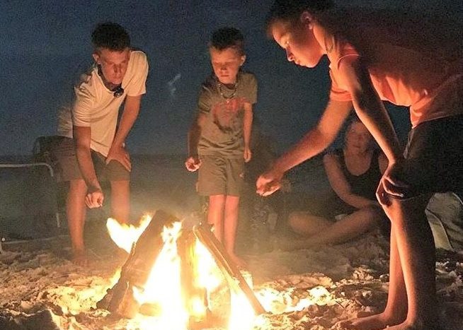 Making Smores Around A Campfire